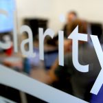 color photo of 'Clarity' printed on the glass door at Clarity's office