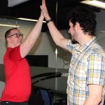 photo of two coworkers high fiving